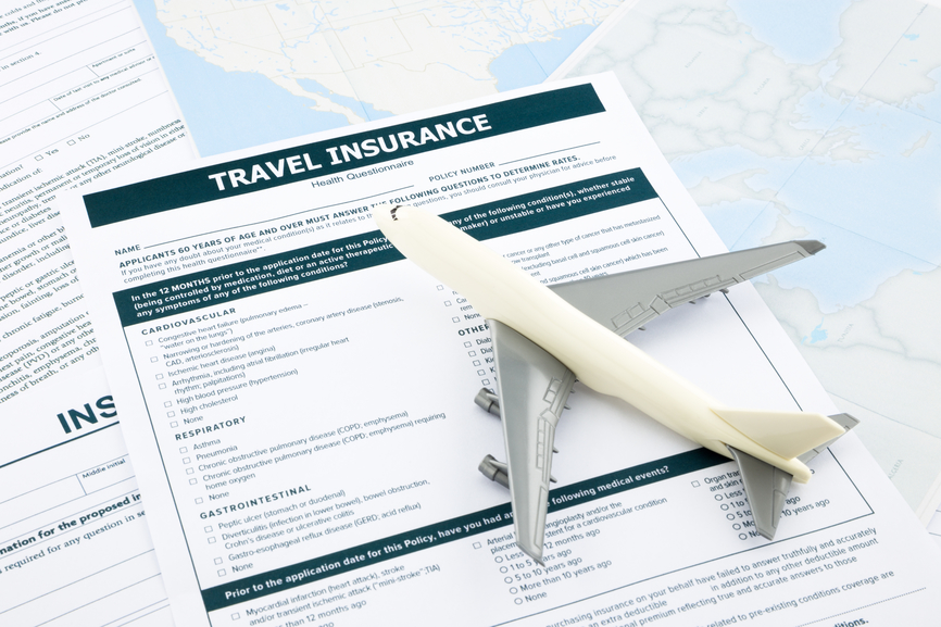 travel insurance form and   plane model